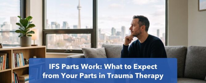 Man on a sofa in a calm Toronto counselling office, looking out toward the CN Tower during IFS parts work trauma therapy.